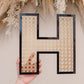 Rattan Buchstabe